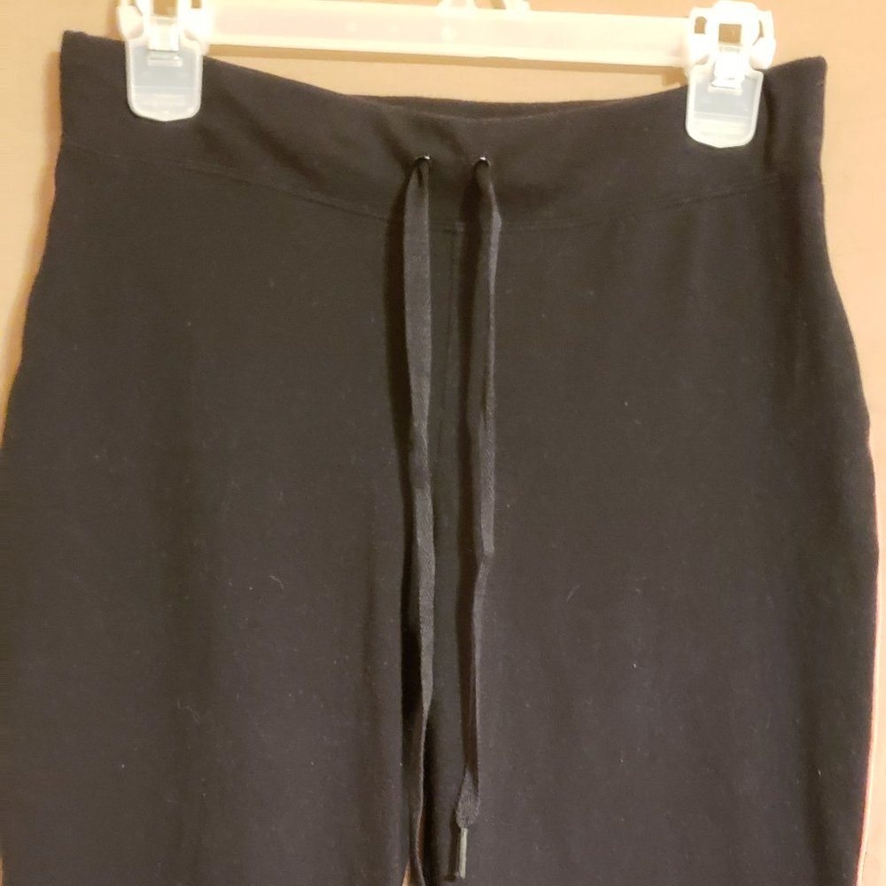 Danskin, Black exercise pants with peach/pink stripe down the sides, Size Small